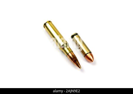 two shiny brass bullets on a pure white background Stock Photo