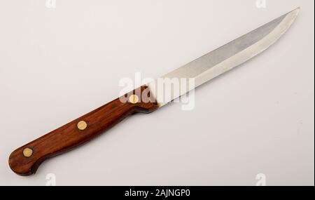 Old vintage knife with wooden handle on white background. Close up Stock Photo