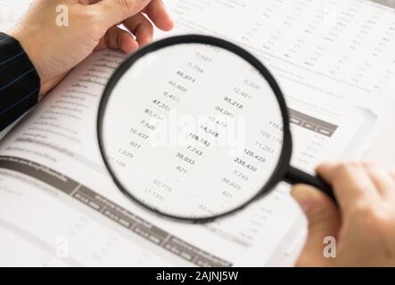 auditor or internal revenue service staff checking annual financial statements of company Stock Photo