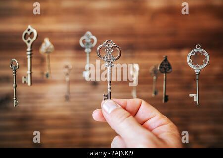 Choosing the right key, metaphorical to make right decisions. Stock Photo