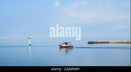 Malacca, Malaysia - Aug 19, 2014. A ferry running on the sea in Malacca, Malaysia. Malacca (Melaka) was included in the list of UNESCO World Heritage Stock Photo