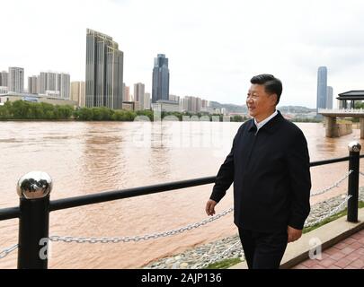 Beijing, China's Gansu Province. 21st Aug, 2019. Xi Jinping, general secretary of the Central Committee of the Communist Party of China, Chinese president and chairman of the Central Military Commission, visits a Yellow River management point to learn about the management, protection and flood control project construction of the Yellow River in Lanzhou, northwest China's Gansu Province, Aug. 21, 2019. Credit: Xie Huanchi/Xinhua/Alamy Live News Stock Photo