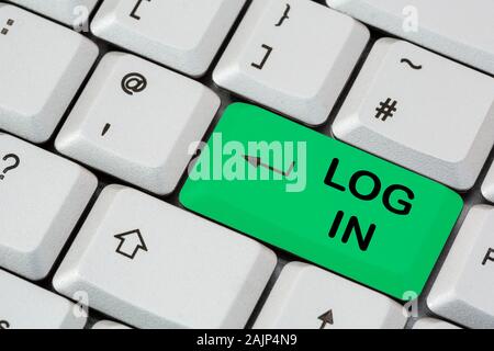 A keyboard with Log In written on a green enter key to login to a website. England, UK, Britain Stock Photo