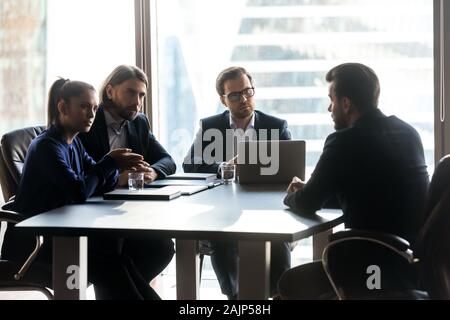 Male candidate speak at job interview in office Stock Photo