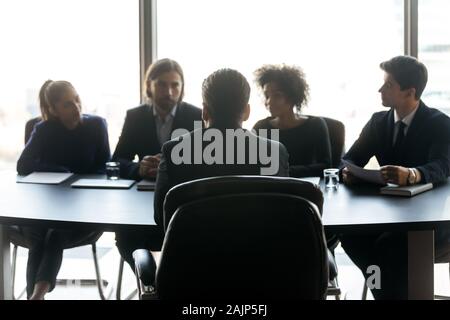 Male job applicant talk at interview in office Stock Photo