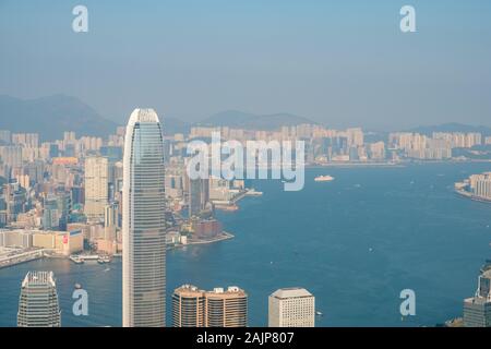 HongKong, China - November, 2019: Skyline of Hong Kong, city aerial view from Victoria Peak on sunny day Stock Photo