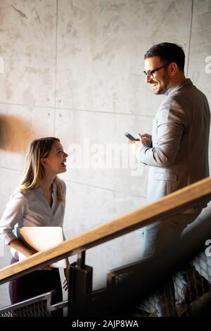Business people having fun and chatting at workplace office Stock Photo