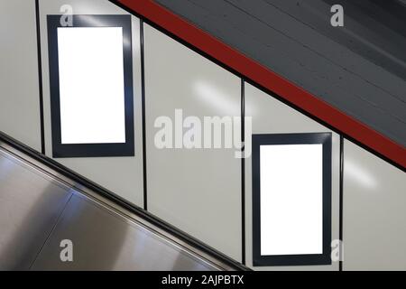 Blank escalator subway advertisements two copyspace white Isolated interior urban Stock Photo