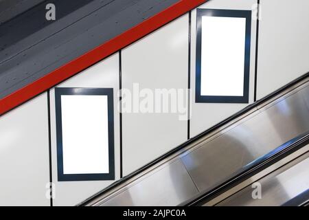 Two White Isolated advertisement billboard posters on train subway station Stock Photo