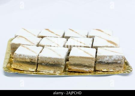 Tasty and typical Spanish cake called cortadillo. Stuffed with angel hair. Stock Photo