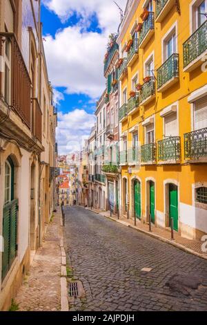 Lisbon, Portugal street perspective view with colorful traditional houses Stock Photo