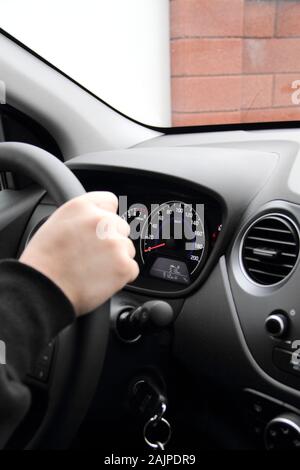 Dashboard with speedometer behind steering wheel inside car Stock Photo ...