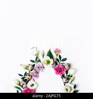 Minimal Happy easter card. Creative layout with flowers, leaves and quail eggs. Stock Photo