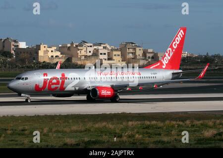 Boeing 737-800 passenger jet plane belonging to British low cost airline Jet2 on the runway while taking off from Malta. Cheap flights. Stock Photo