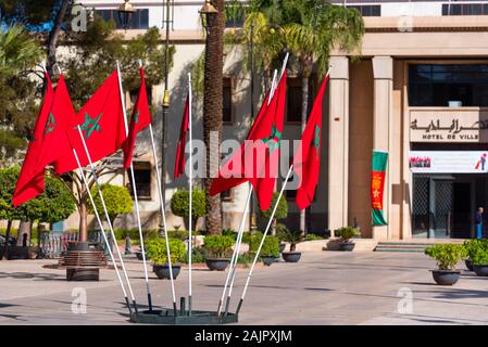 Flags of Morocco on a city street, Marrakesh, Morocco. With selective focus Stock Photo