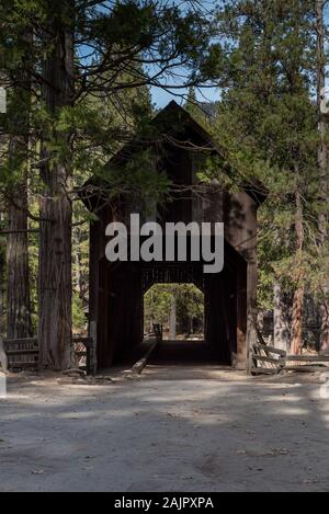 The Wawona Covered Bridge  spanning the South Fork of the Merced River near Wawona, is a tourist attraction and historic legacy at Yosemite National P Stock Photo