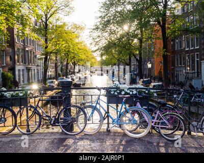 Parked bicycles on a canal bridge in Amsterdam's old Jordaan quarter (Egelantiersgracht) Stock Photo