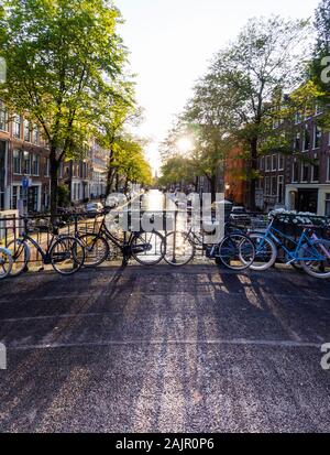 Parked bicycles on a canal bridge in Amsterdam's old Jordaan quarter (Egelantiersgracht) Stock Photo