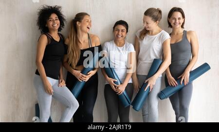Beautiful diverse women with yoga mats posing for portrait Stock Photo