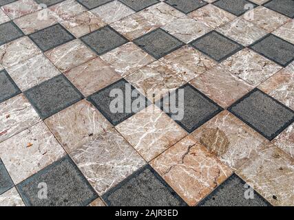 Checkered style floor with black and white tiles Stock Photo