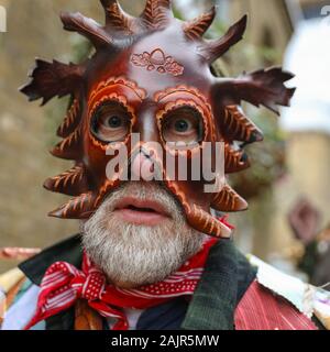 London, UK. 5th Jan 2020. The 25th annual Twelfth Night Celebration, an ancient Midwinter custom, is held at Bankside, performed by 'The Lions part' players. The Holly Man, decked in green foliage, is piped over the River Thames. He is joined by the London Mummers, to toast (wassail) the people, and perform freestyle folk combat play in colourful costumes. The procession moves across the river, to Shakespeare's Globe and on to the St George Inn, Southwark. Credit: Imageplotter/Alamy Live News Stock Photo