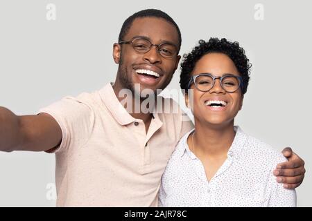 African couple make selfie photo look at camera webcam view Stock Photo
