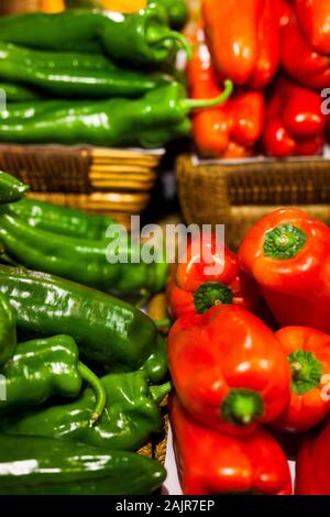 Red and green peppers in a shop Stock Photo