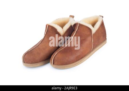 Studio shot of a pair of mens slippers isolated on a white background - John Gollop Stock Photo