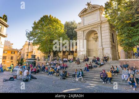 ROME, ITALY - OCTOBER 10, 2017: people are listening to an outdoor concert in Trilussa Square in Trastevere district in Rome, Italy