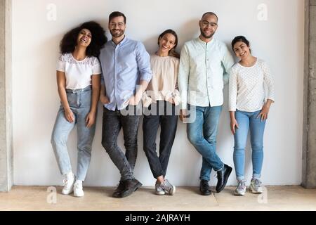 Portrait of smiling multiethnic friends posing together Stock Photo