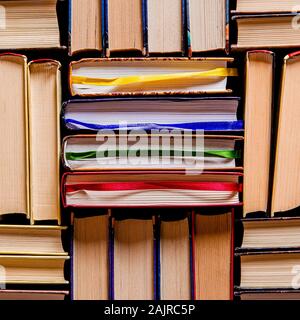 Lots of multi-colored books with multi-colored bookmarks close-up Stock Photo