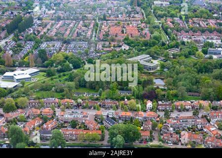 Aerial view of Amsterdam city outside Schiphol airport during flight landing Stock Photo