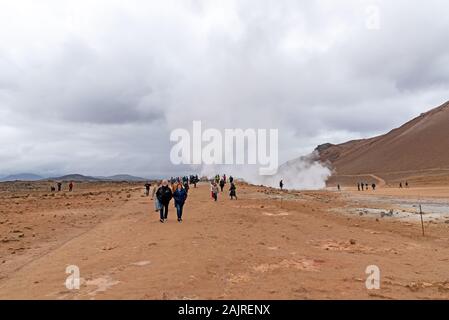 Myvatn, Iceland - Sept 11, 2019: Tourists at Namafjall geyser,  its a Geothermal Area located in Northeast Iceland, on the east side of Lake Myvatn. Stock Photo