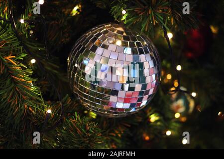 Close-up view of disco ball has decorated on Christmas tree Stock Photo