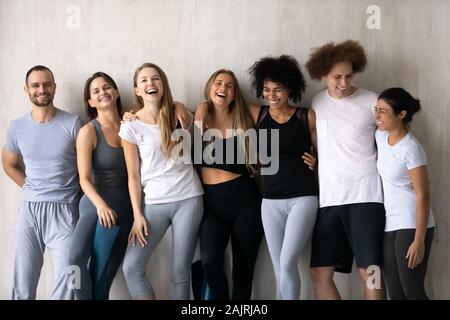 Happy diverse people having fun after group yoga lesson Stock Photo