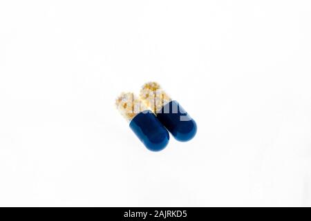 Antibiotics capsules or painkillers isolated on white. Medicine concept, pills close up, copy space Stock Photo