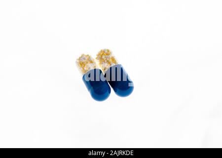 Antibiotics capsules or painkillers isolated on white. Medicine concept, pills close up, copy space Stock Photo
