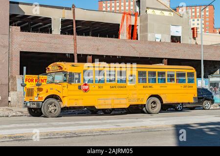 classic yellow school bus in side view parked at Coney Island, Brooklyn, New York, United States Stock Photo