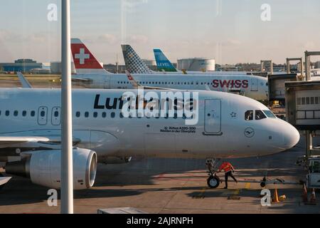 Amsterdam, Netherland - December, 2019: Lufthansa airplane and other airlines on airport in Amsterdam Stock Photo