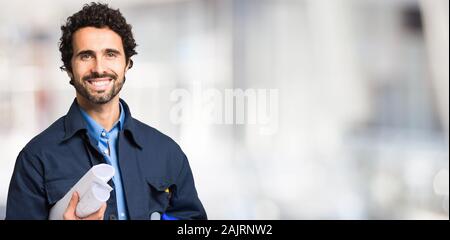 Portrait of a worker in front of a bright background Stock Photo