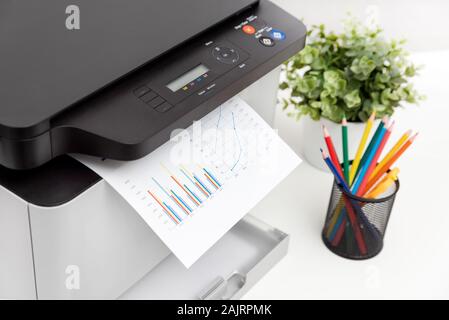 Multifunction device, copier, scanner, printer in office. Professional laser printer. Stock Photo