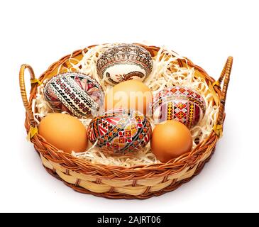 Basket with different easter eggs mint on an isolated white background Stock Photo