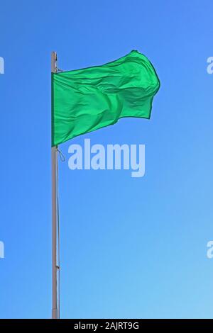 Green flag, green for go, beach flag, safe for bathing - low hazard, calm conditions