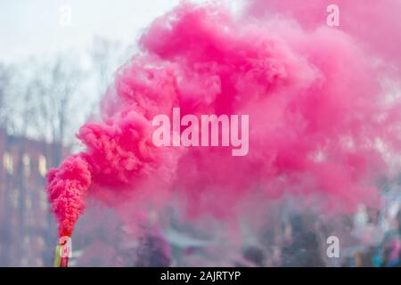 festival of colored smoke pink smoke bomb Stock Photo