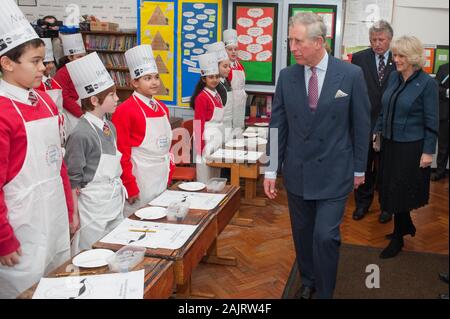 The Prince of Wales and the Duchess of Cornwall attending the launch of 'chefs adopt a school' programme at St George's primary school in Mayfair. Stock Photo