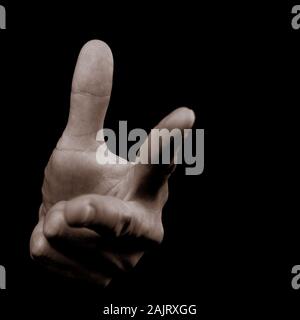 Human hand on black background showing number 3 (three) - counting from the top Stock Photo