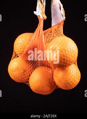 oranges in the shopping bag, net Stock Photo