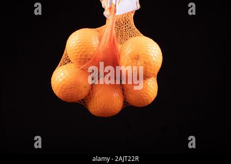 oranges in the shopping bag, net Stock Photo