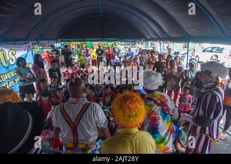 The Community “Aku Badut Indonesia” (I am Indonesian Clown) entertains a number of children affected by the floods that following torrential rains since the past 5 days. The activity is aimed at trauma healing and a form of caring for Jakarta flood victims, especially children. Stock Photo