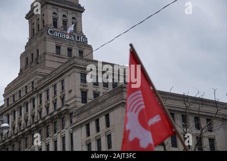 TORONTO, CANADA - 01 04 2020: Red flag of the Communist Party of Canada in front of the Canada Life building. Stock Photo